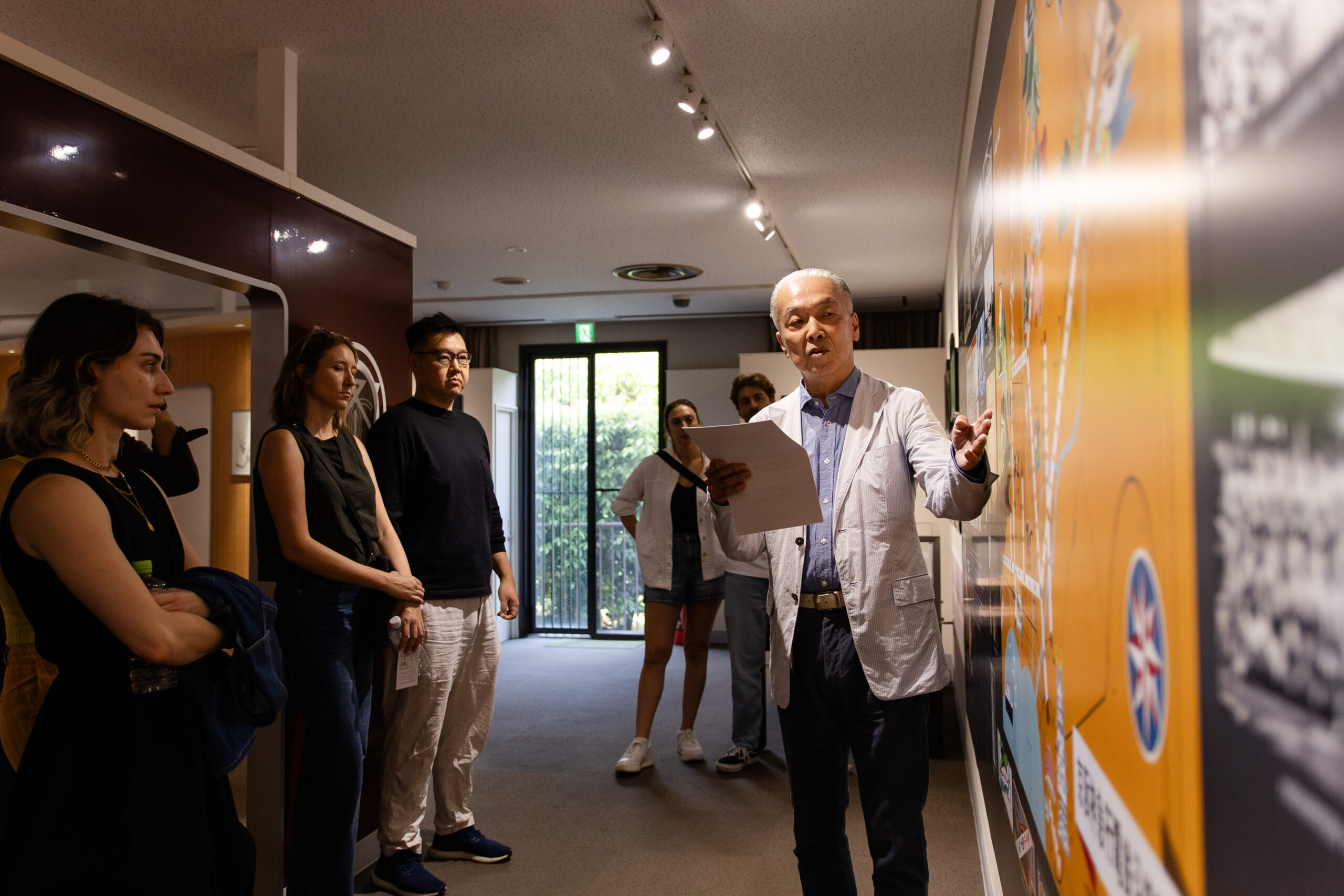 FUTRFEST participants listening to an expert's talk during a gallery tour